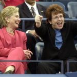 US Senator Hillary Clinton (L) watches tennis hall